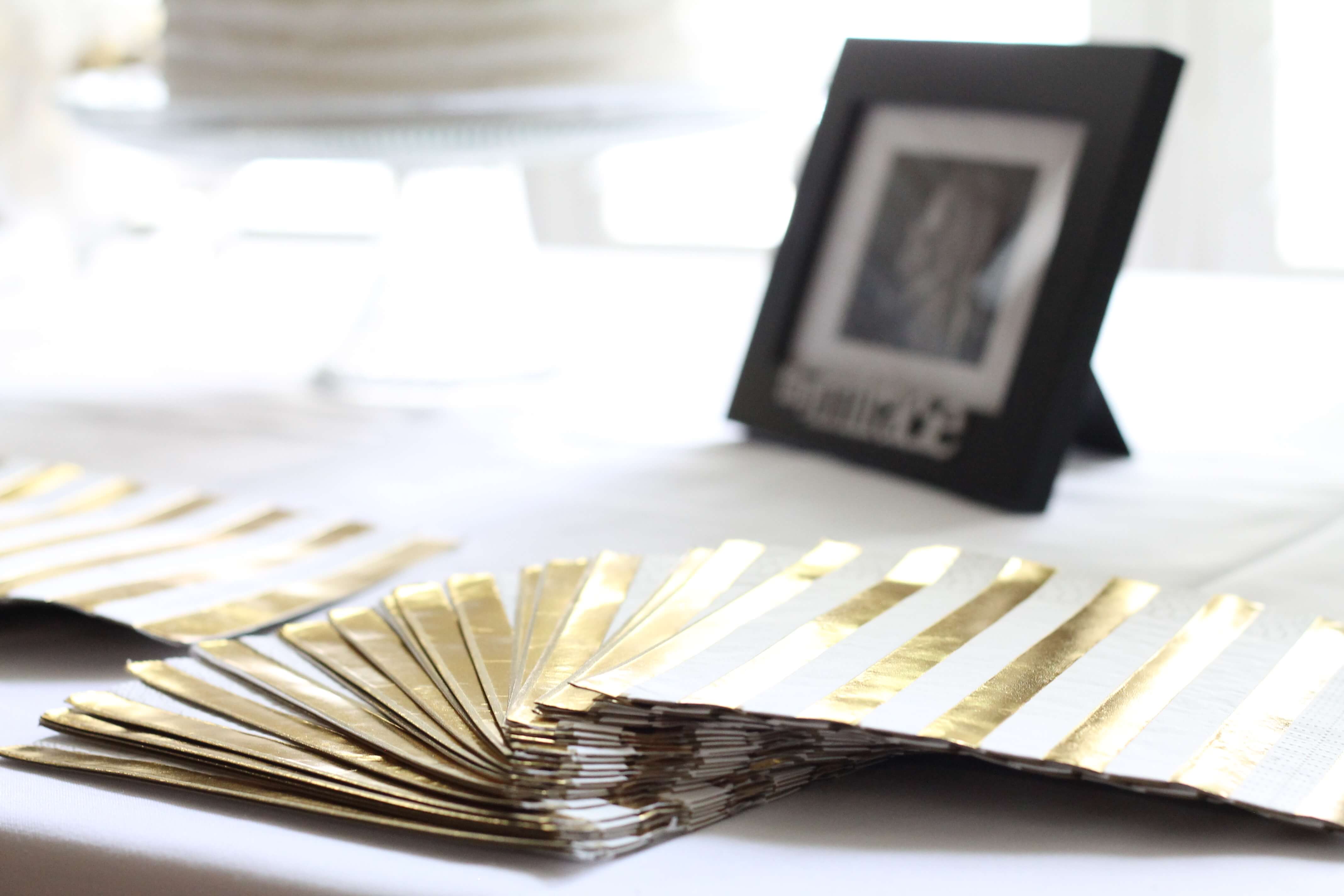 A gender neutral baby shower sprinkle. All the details from an elegant and simple shower in a color scheme of white, gray, and gold.