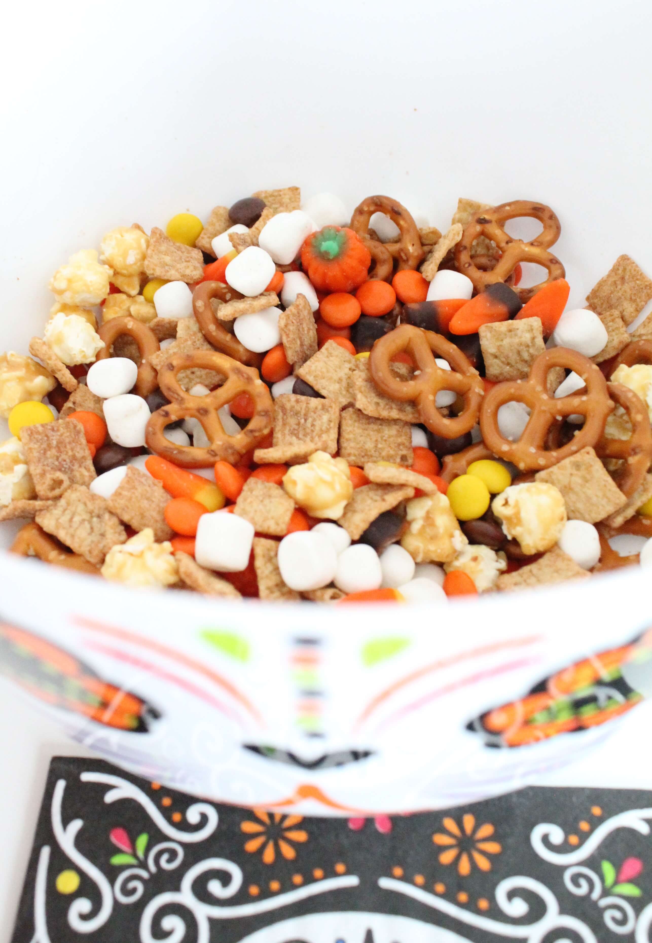 Kid-approved, fall-inspired snack mix. The perfect mix of salty and sweet. Perfect for party mix for Dia de los Muertos, Halloween, or any festive fall party. 