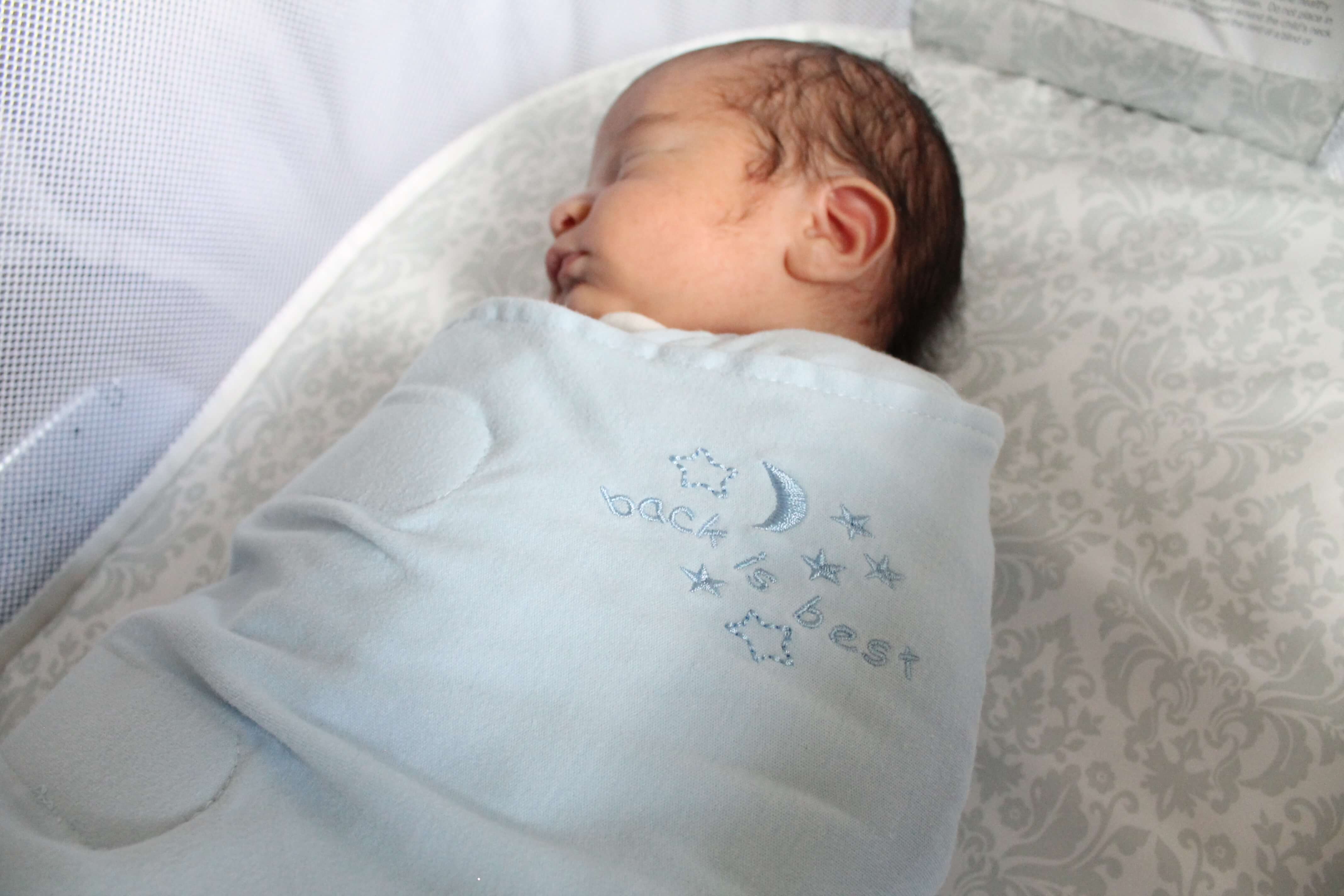 swaddle baby in bassinet