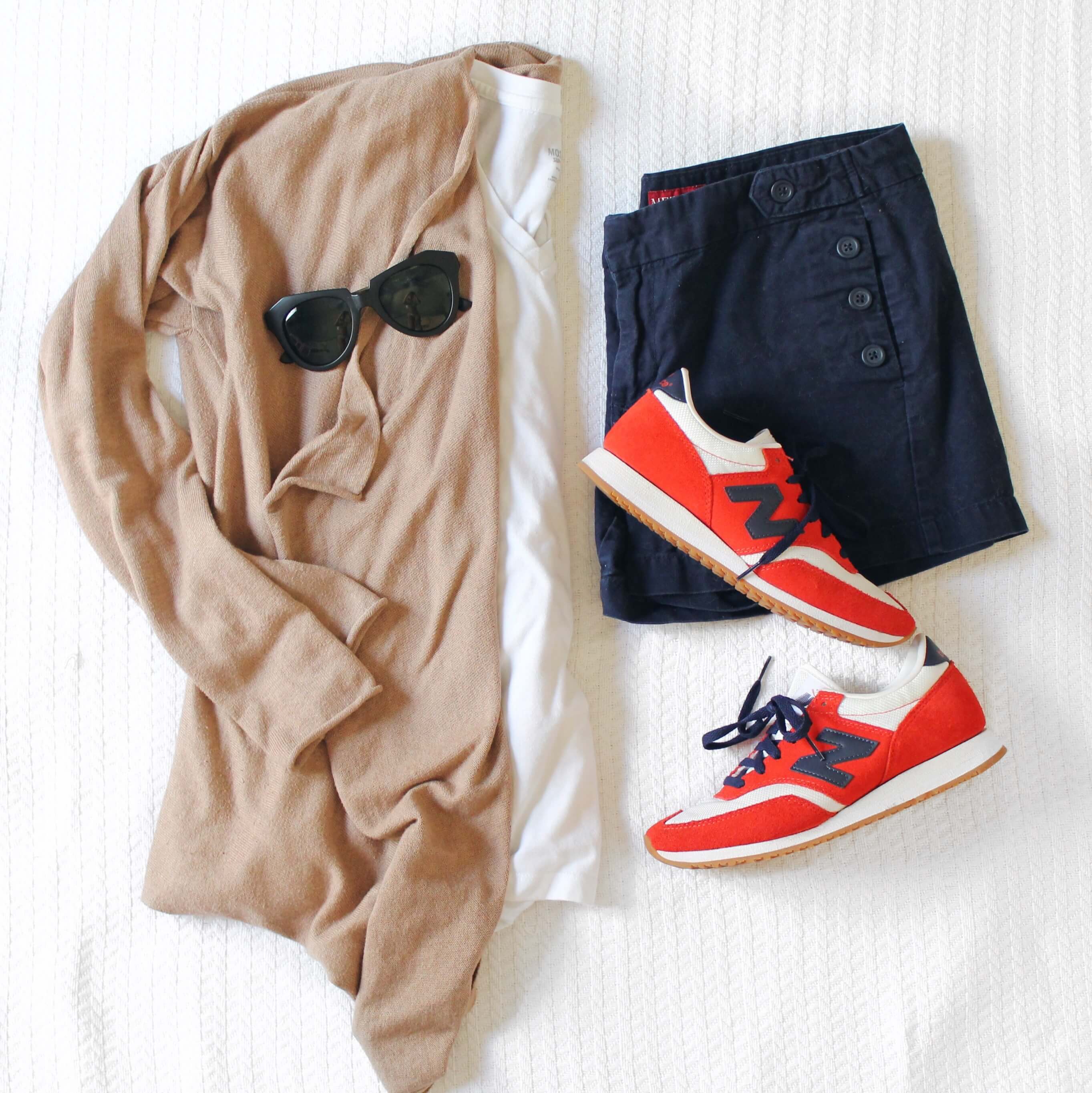 Classic spring look: camel colored cardigan, white tee, navy shorts and sneakers. What to wear with your J.Crew sneakers. 