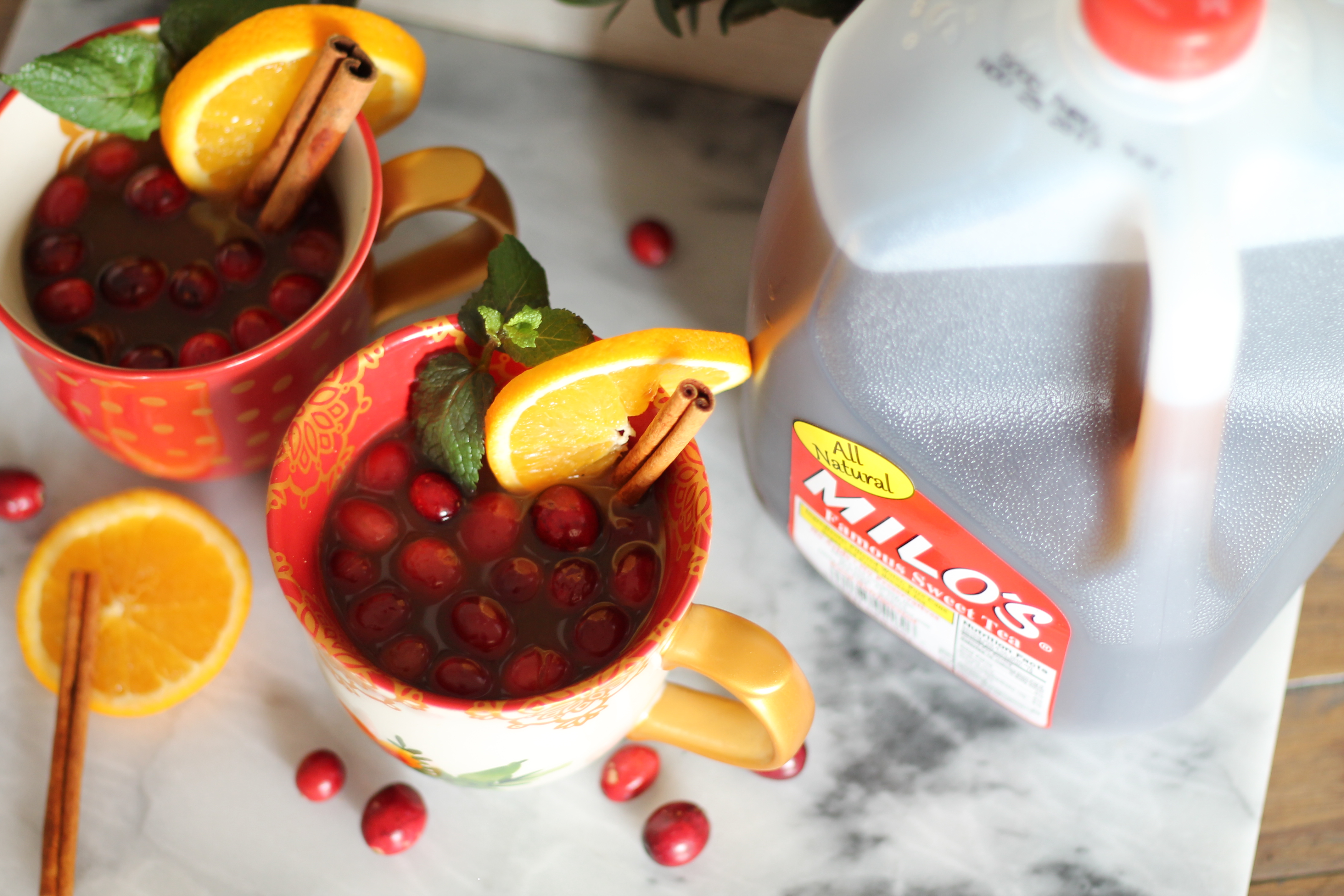 Hostess Tips for the Holidays :: How to stress less and enjoy the holidays more! You also can't miss this hot Milo's Tea with cranberries and cinnamon, apple juice and cranberry juice. So yummy! AD #passthemilos #hotapplecidertea