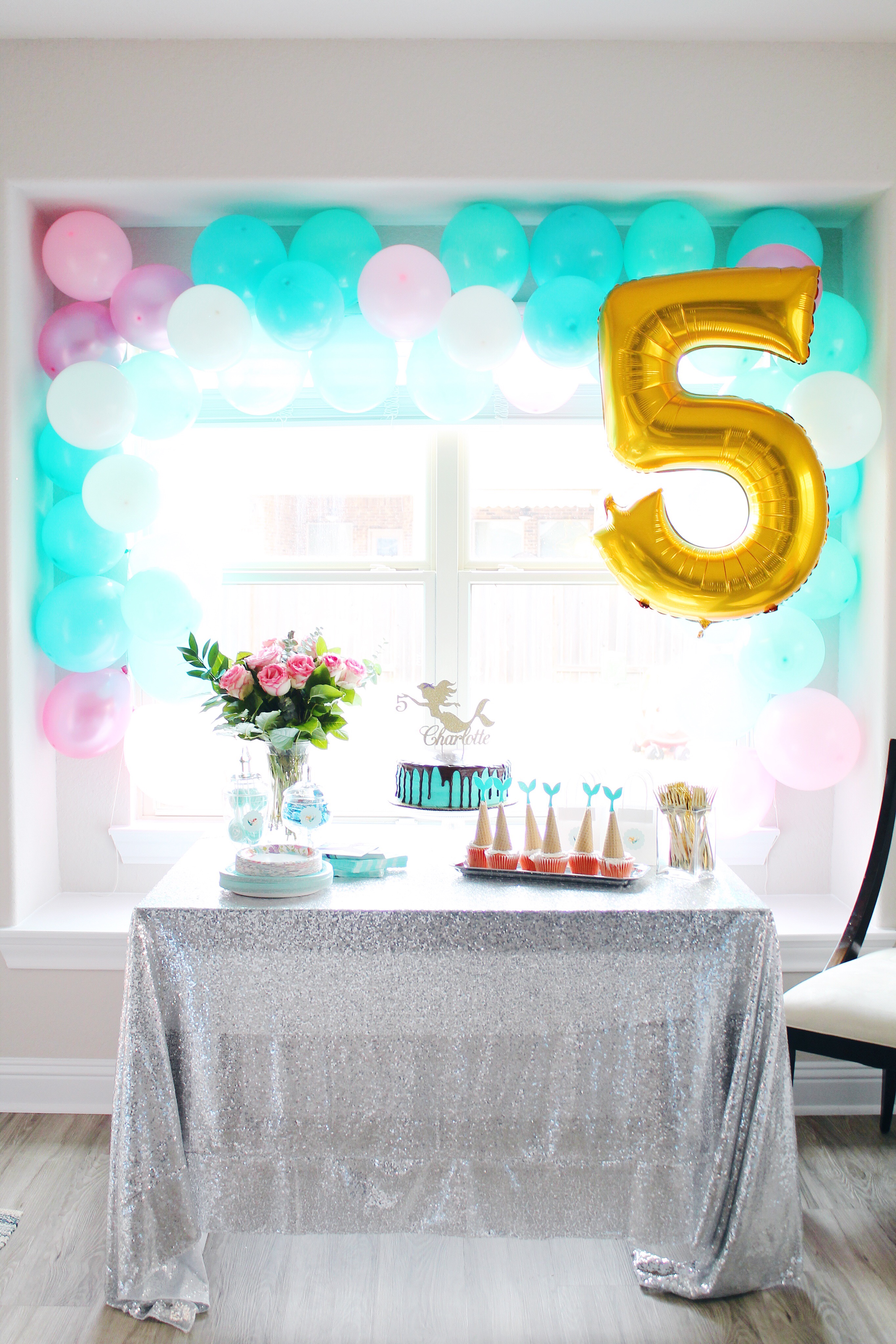 Mermaid Inspired Birthday Party. DIY balloon arch and all the other details for the perfect mermaid party! #birthdayparty #birthdaypartydecor #partydecor