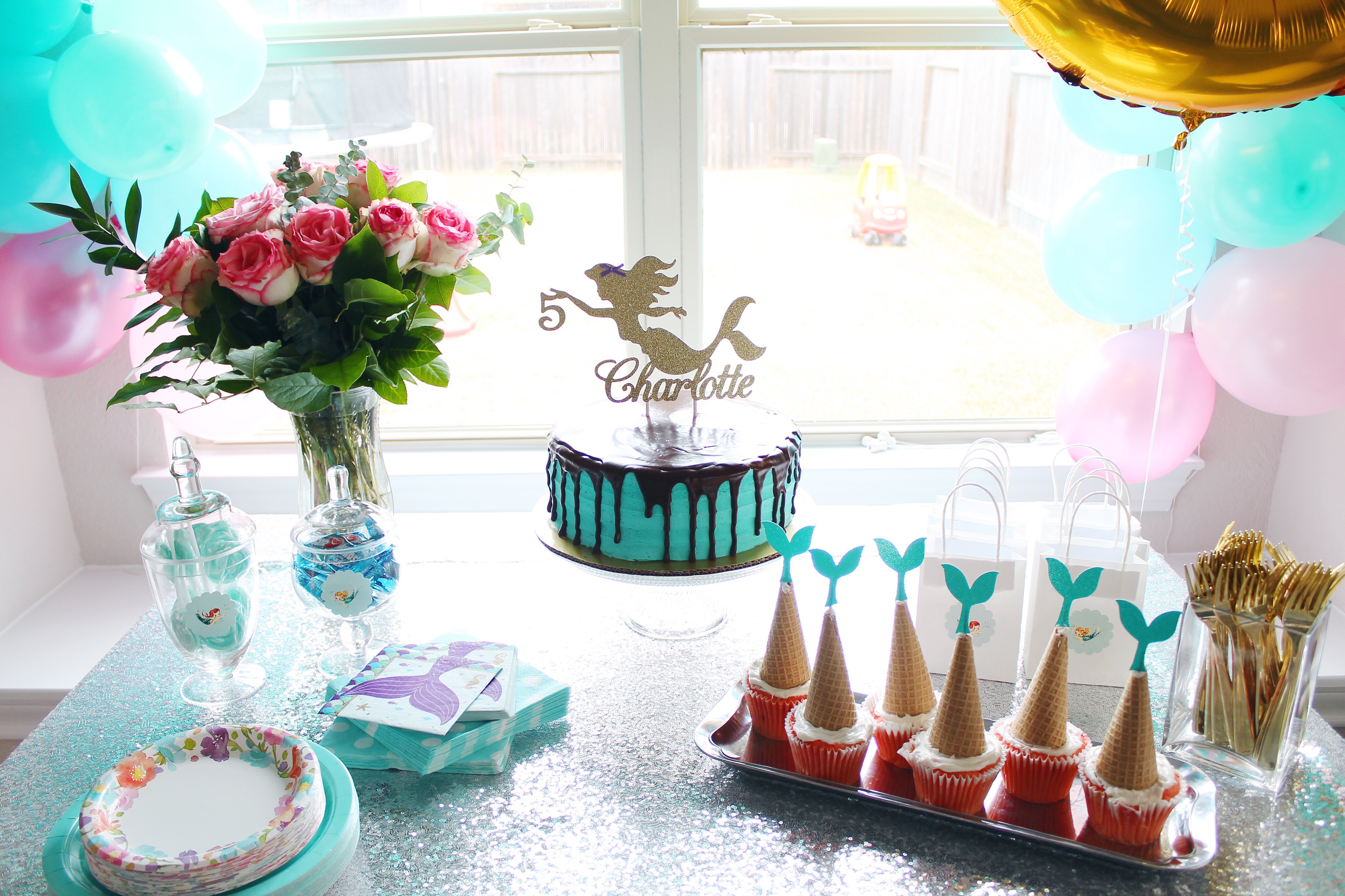 Mermaid Inspired Birthday Party. DIY balloon arch and all the other details for the perfect mermaid party! #birthdayparty #birthdaypartydecor #partydecor