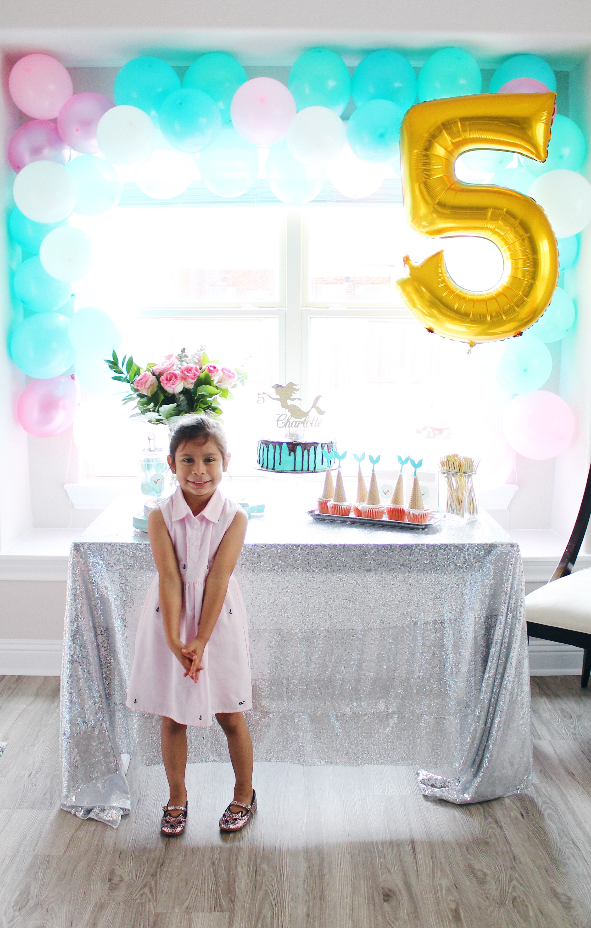 Mermaid Inspired Birthday Party. DIY balloon arch and all the other details for the perfect mermaid party! #birthdayparty #birthdaypartydecor #partydecor