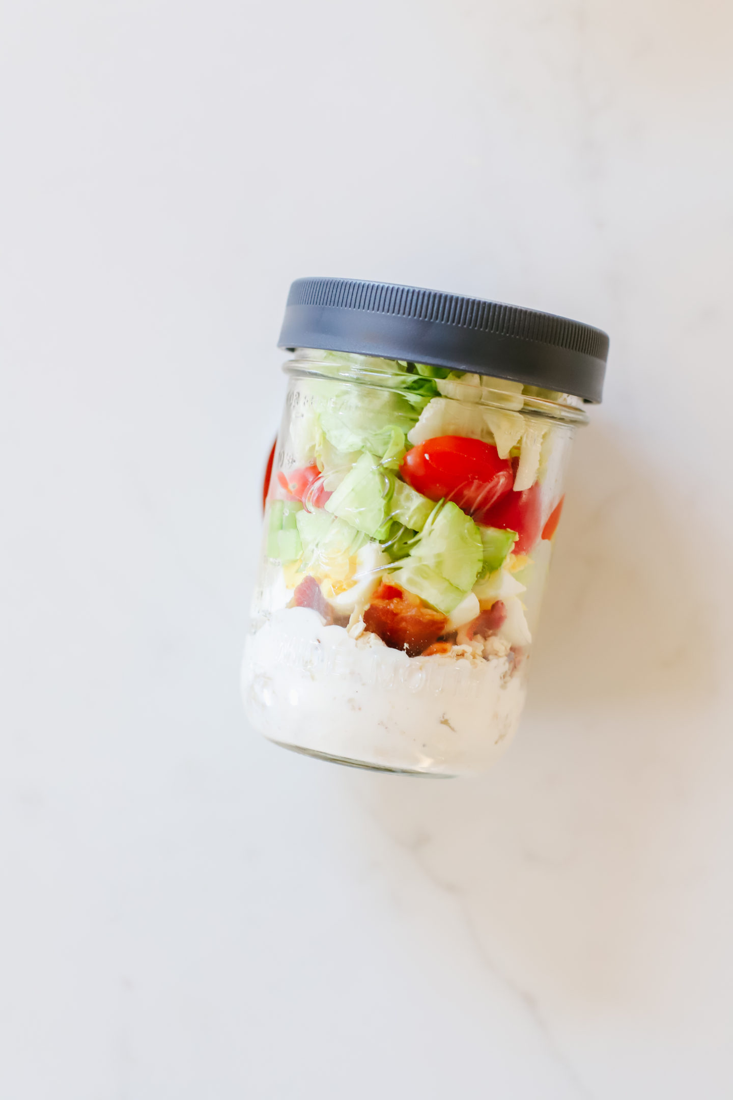 Meal prep with Ball® Jars to create the perfect Cobb Salad (Keto & Whole30® approved)! Add an easy and nutritious salad to your meal prep routine, always ready to go to help you stay on track! It's the perfect mason jar salad. #ad #Whole30WithBall #MadeWithBall #BallJars #Whole30Diet #BallInAJar @BallCanning